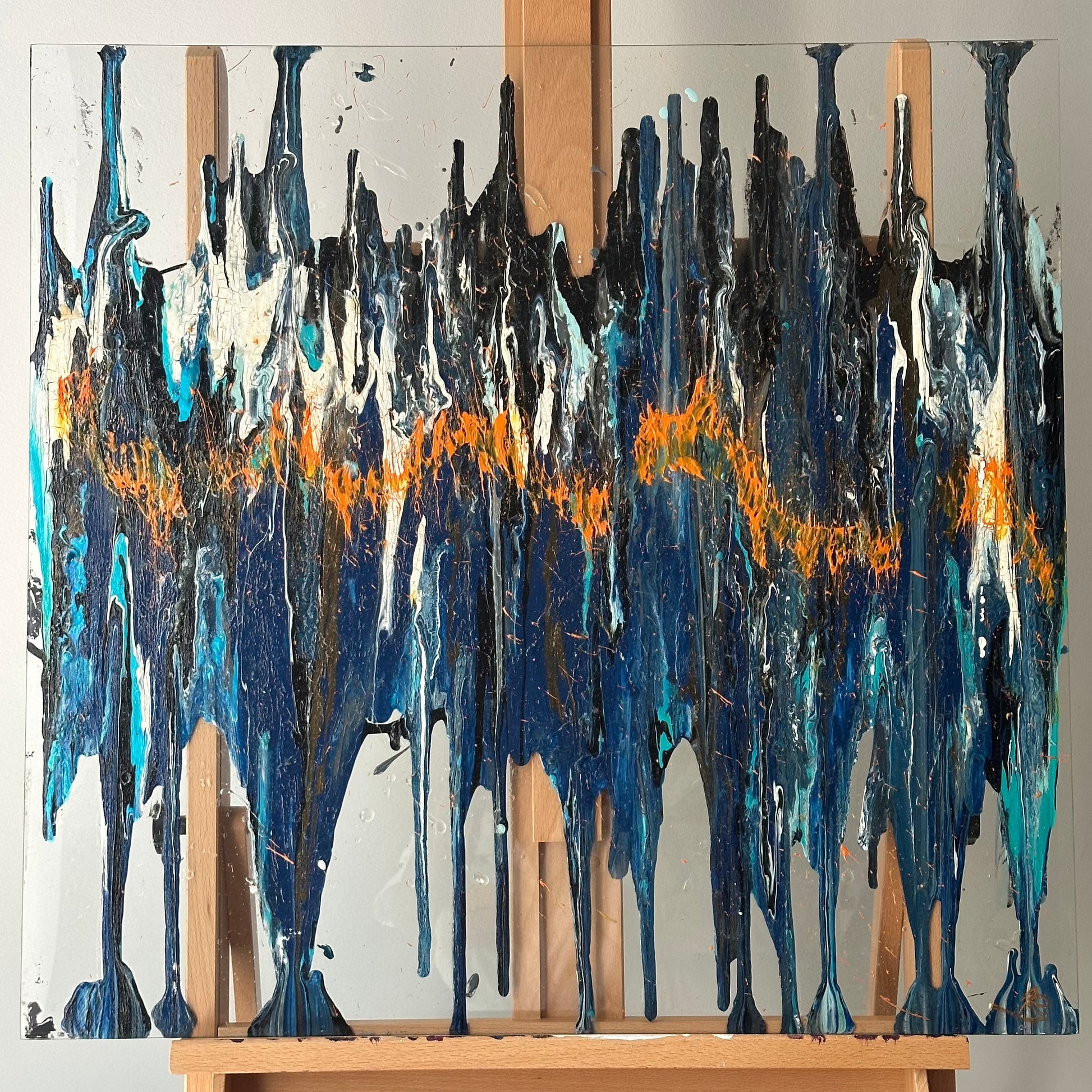 Head Above Water is an abstract piece on reclaimed glass incorporating varying shades of blue and black. To add depth and richness to the painting traces of orange and black are used.